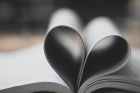 closeup photography of book page folding forming heart
